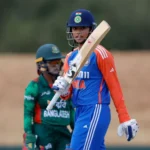 An image featuring Smriti Mandhana's bat-raising pose.