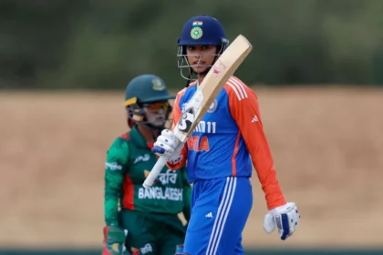 An image featuring Smriti Mandhana's bat-raising pose.