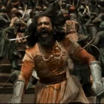 An image of Vicky Kaushal fighting in a battle as Chhatrapati Sambhaji Maharaj in Chhaava