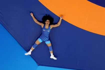 Vinesh Phogat lying down after winning a match